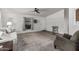 Inviting living room with plush carpeting, neutral walls, and a ceiling fan at 2233 E Behrend Dr # 162, Phoenix, AZ 85024