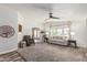 Bright living room boasts neutral palette, ceiling fan, plush carpeting, and large windows at 2233 E Behrend Dr # 162, Phoenix, AZ 85024