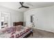 Spacious carpeted bedroom showcasing attached bathroom and walk in closet at 2233 E Behrend Dr # 162, Phoenix, AZ 85024