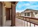 A balcony view showcasing well-maintained townhomes with individual garages under a bright blue sky at 2250 E Deer Valley Rd # 26, Phoenix, AZ 85024