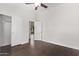 Bedroom features wood-look flooring, and access to an outdoor balcony, and a large closet at 2250 E Deer Valley Rd # 26, Phoenix, AZ 85024