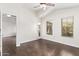 Spacious bedroom boasts wood floors, ceiling fan, windows and a door to the outside at 2250 E Deer Valley Rd # 26, Phoenix, AZ 85024