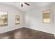Bright bedroom with wood floors, ceiling fan and three windows at 2250 E Deer Valley Rd # 26, Phoenix, AZ 85024