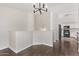 Open dining area with views of the modern kitchen and dark hardwood floors at 2250 E Deer Valley Rd # 26, Phoenix, AZ 85024