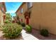 The exterior of the property features desert landscaping leading to townhomes with private entrances at 2250 E Deer Valley Rd # 26, Phoenix, AZ 85024