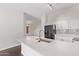 Bright kitchen showcases white cabinetry, quartz countertops, stainless faucet, and black appliances at 2250 E Deer Valley Rd # 26, Phoenix, AZ 85024