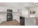 Updated kitchen featuring white cabinets, quartz countertops, subway tile backsplash, and stainless appliances at 2250 E Deer Valley Rd # 26, Phoenix, AZ 85024