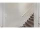 Neutral stairway featuring carpeted steps and a white handrail at 2250 E Deer Valley Rd # 26, Phoenix, AZ 85024