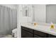 A bathroom with a double vanity and a shower with a curtain at 22938 E Calle Luna --, Queen Creek, AZ 85142