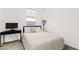 A well-lit bedroom featuring neutral tones and a desk at 22938 E Calle Luna --, Queen Creek, AZ 85142
