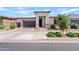 Charming single-story home featuring a manicured front yard and a welcoming entrance in a suburban neighborhood at 22938 E Calle Luna --, Queen Creek, AZ 85142