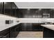 Gourmet kitchen featuring sleek cabinetry, stainless steel appliances, subway tile backsplash, and ample counter space at 22938 E Calle Luna --, Queen Creek, AZ 85142