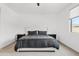 Serene bedroom with neutral colors, a comfortable bed, and ample natural light creating a relaxing atmosphere at 22938 E Calle Luna --, Queen Creek, AZ 85142