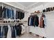 Spacious walk-in closet with ample shelving and hanging storage at 22938 E Calle Luna --, Queen Creek, AZ 85142