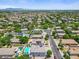 Panoramic aerial view of the community showcasing houses, roads, landscaping and distant mountains at 2466 E Harrison Ct, Gilbert, AZ 85295