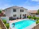 Beautiful backyard showcasing a refreshing pool, outdoor seating, fire pit, and covered patio at 2466 E Harrison Ct, Gilbert, AZ 85295