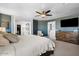 This primary bedroom features blue walls, a walk-in closet, and an ensuite bathroom at 2466 E Harrison Ct, Gilbert, AZ 85295