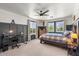 Bedroom features paneled walls, a ceiling fan, and dual windows that provide plenty of light at 2466 E Harrison Ct, Gilbert, AZ 85295