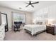 Bright bedroom with a workstation next to the window and a tufted headboard at 2466 E Harrison Ct, Gilbert, AZ 85295