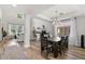 Open dining area with hardwood floors, stylish lighting, and direct access to the living space, ideal for entertaining guests at 2466 E Harrison Ct, Gilbert, AZ 85295