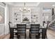 Elegant dining room featuring built-in shelving, a modern chandelier, and a sophisticated table set, perfect for Gathering gatherings at 2466 E Harrison Ct, Gilbert, AZ 85295