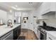 Well-appointed kitchen boasting stainless steel appliances, white cabinetry, and ample counter space at 2466 E Harrison Ct, Gilbert, AZ 85295