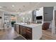 Open-concept kitchen with a large island, sleek appliances, and seamless flow into the living space at 2466 E Harrison Ct, Gilbert, AZ 85295