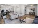 Cozy living room featuring hardwood floors, stylish seating, and a decorative rug, perfect for relaxation and entertaining at 2466 E Harrison Ct, Gilbert, AZ 85295