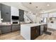 Combined kitchen and living space featuring an entertainment center and an extra large kitchen island at 2466 E Harrison Ct, Gilbert, AZ 85295