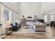 Spacious living room with soaring ceilings, large windows, and contemporary furnishings, offering an open and airy ambiance at 2466 E Harrison Ct, Gilbert, AZ 85295