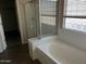 Soaking tub with shower and window at 24919 W Illini St, Buckeye, AZ 85326