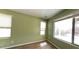 Cozy bedroom with wood-look floors and large windows at 24919 W Illini St, Buckeye, AZ 85326