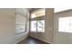 Bright entryway featuring high ceilings and abundant natural light from multiple windows at 24919 W Illini St, Buckeye, AZ 85326