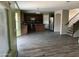 Open living space with tile floors connecting the kitchen, living room, and staircase at 24919 W Illini St, Buckeye, AZ 85326