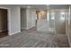Upstairs loft with carpeted flooring and natural light from windows at 3390 S 180Th Ln, Goodyear, AZ 85338