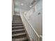 Carpeted staircase with white railing leading to the upper level of the home at 3390 S 180Th Ln, Goodyear, AZ 85338
