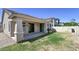 Beautiful backyard with a covered patio, lush green grass and manicured landscaping for outdoor enjoyment at 3558 E Windsor Dr, Gilbert, AZ 85296