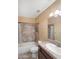 Bathroom featuring a tiled shower-tub combination, single sink vanity, and neutral color scheme at 3558 E Windsor Dr, Gilbert, AZ 85296