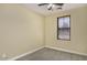 Cozy bedroom featuring neutral carpet, a large window with blinds, and ample space at 3558 E Windsor Dr, Gilbert, AZ 85296