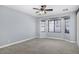 Spacious bedroom with carpet, large windows, ceiling fan, and plenty of natural light at 3558 E Windsor Dr, Gilbert, AZ 85296