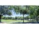 Scenic view of the community park, featuring mature trees, green lawns, and a relaxing atmosphere at 3558 E Windsor Dr, Gilbert, AZ 85296