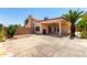 An expansive backyard with covered patio, desert landscaping, and concrete hardscape at 3608 W Morelos St, Chandler, AZ 85226