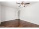 Empty bedroom featuring a ceiling fan and a door leading to another room at 3608 W Morelos St, Chandler, AZ 85226