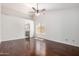 Large primary bedroom features a ceiling fan, hardwood floors, natural light, and entry to updated kitchen at 3608 W Morelos St, Chandler, AZ 85226