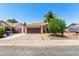 Charming single-story home featuring a well-maintained yard, desert landscaping, and a spacious driveway at 3608 W Morelos St, Chandler, AZ 85226