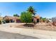 Charming single-story home with desert landscaping, spacious driveway, and mature trees in a well-kept neighborhood at 3608 W Morelos St, Chandler, AZ 85226