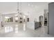 Modern kitchen with gray cabinetry, stainless steel appliances, a large island with seating, and sleek tile flooring at 3608 W Morelos St, Chandler, AZ 85226