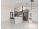Modern kitchen with gray cabinetry, stainless steel appliances, a large island with seating, and sleek tile flooring at 3608 W Morelos St, Chandler, AZ 85226