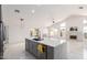 Bright, open kitchen featuring a large island, marble countertops, and modern appliances, perfect for cooking and entertaining at 3608 W Morelos St, Chandler, AZ 85226