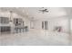 Bright and spacious living room featuring sleek tile floors, modern lighting, and access to a dining and kitchen area at 3608 W Morelos St, Chandler, AZ 85226